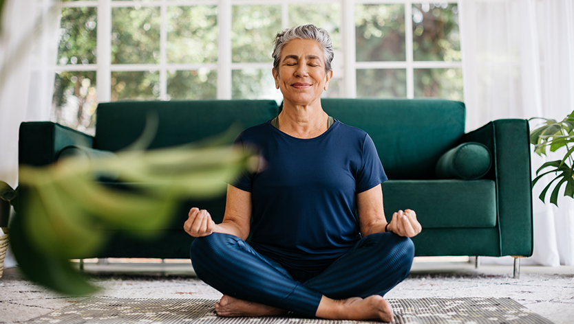 Woman meditating in lotus position 