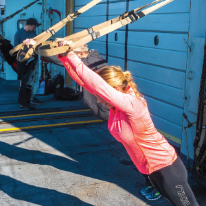 woman exercising aboard ship